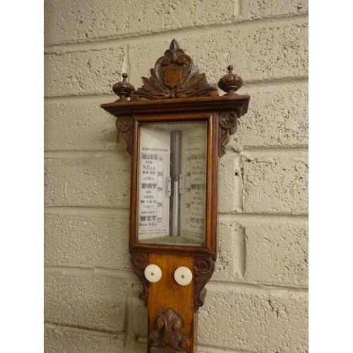 295 - Good antique carved oak cased Admiral Fitzroy mercury barometer and thermometer. L. 104cm approx.