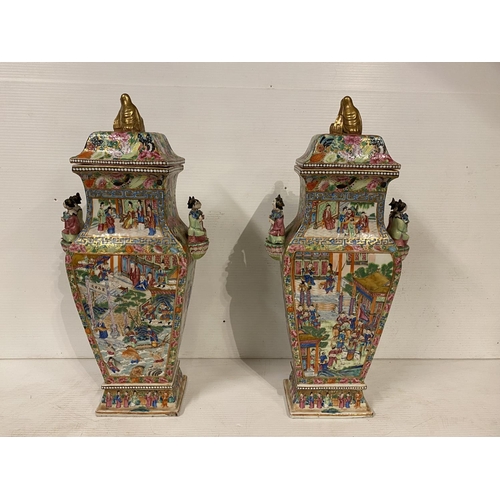 296 - A fine pair of Chinese Famille Rose Canton Export Vases with lids of square form, richly decorated i... 