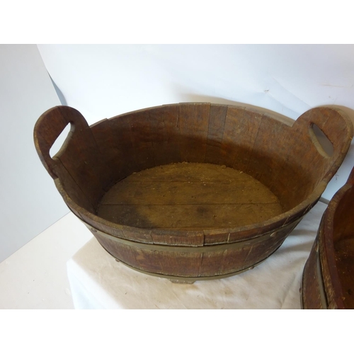 35 - A pair of antique oak and brass bound oval shaped vats. W. 50cm, D. 35cm, H. 20cm.  (one handle miss... 