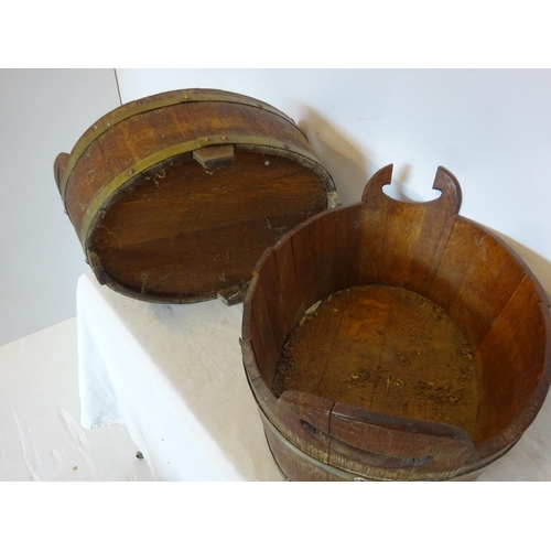 35 - A pair of antique oak and brass bound oval shaped vats. W. 50cm, D. 35cm, H. 20cm.  (one handle miss... 