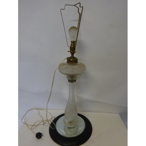 38 - Antique cut glass oil lamp now electrified on circular base. Over all height 82cm.