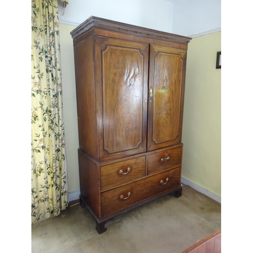 Georgian mahogany two door linen press, the upper section fitted with ...