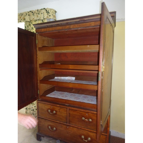 Georgian mahogany two door linen press, the upper section fitted with ...