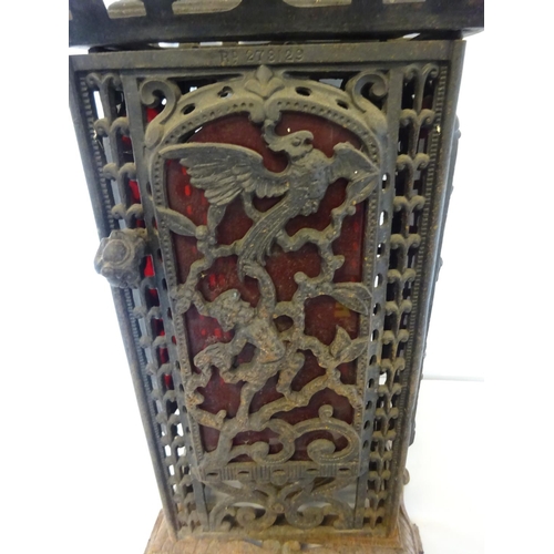 41 - Antique cast iron framed floor heater complete with original interior and registration number. H. 75... 