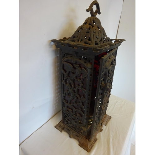 41 - Antique cast iron framed floor heater complete with original interior and registration number. H. 75... 