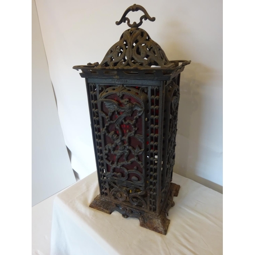 41 - Antique cast iron framed floor heater complete with original interior and registration number. H. 75... 