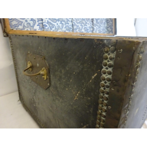 42 - Two antique leather and brass banded and studded trunks with carrying handles and name plate for Gou... 