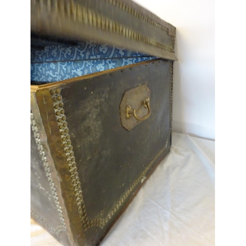 42 - Two antique leather and brass banded and studded trunks with carrying handles and name plate for Gou... 