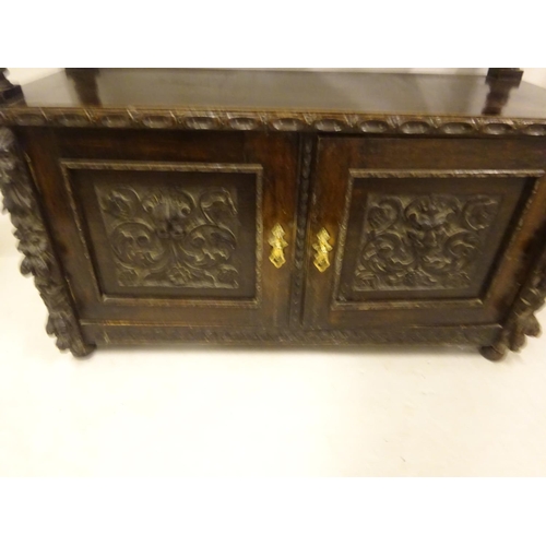 435 - 19th century carved oak side server fitted with drawers and cupboards. W. 125cm, D. 53cm, H. 110cm a... 