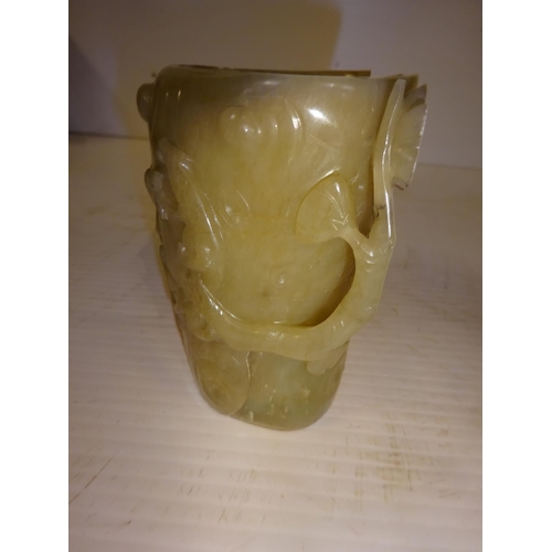 444 - An antique jade libation cup, carved around the exterior with bats amongst branches. (chip on top ri... 