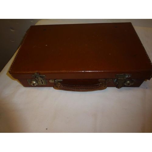 448 - A leather writing travelling box Capt. C. French, Hampshire Reg. together with a leather attache cas... 