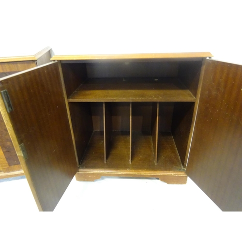 46 - A pair of low walnut two door side cabinets on castors. D. 38cm, W. 53cm, H. 60cm.