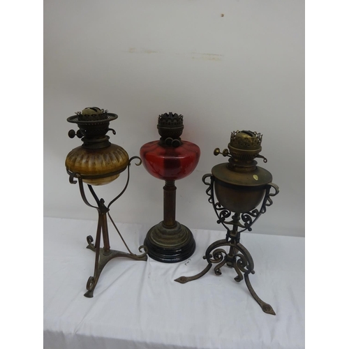 48 - Three oil lamps.