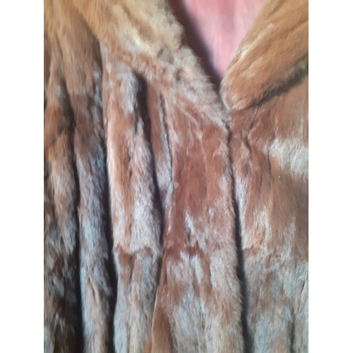 495 - A mink 3/4 length coat.