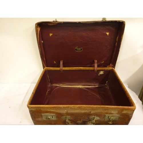 5 - Three suitcases and a top hat in case, the leather suitcase by Robert Day & Son, Cork, the top hat b... 