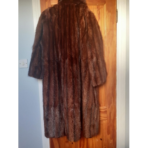 72 - Good quality full length fur coat.