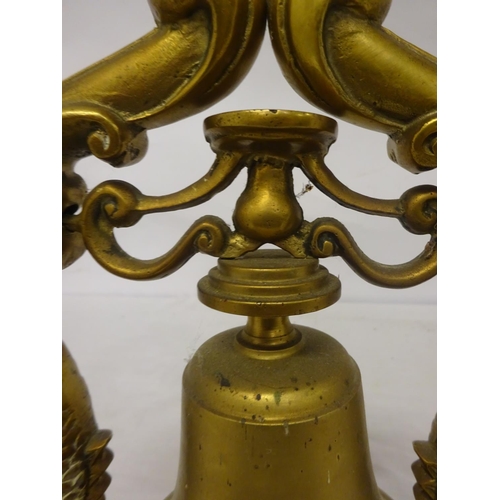 74 - Heavy brass bell on ornate supports and rectangular shaped base. Overall height 32cm. Base - 28cm x ... 