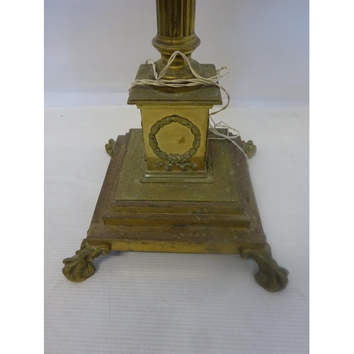 80 - A good old heavy brass floor lamp, the long cornithian column raised on square stepped base with cla... 