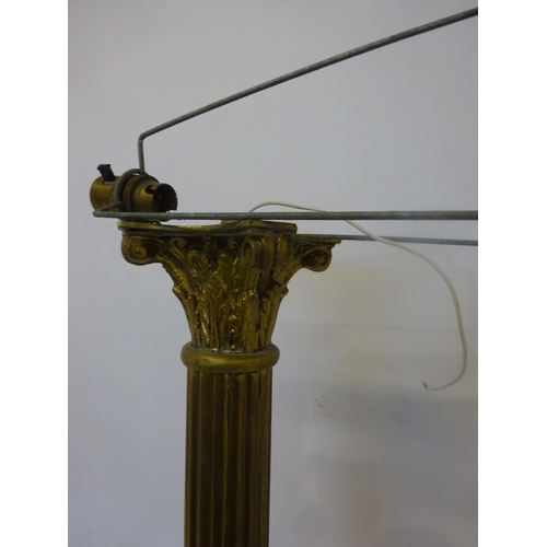 80 - A good old heavy brass floor lamp, the long cornithian column raised on square stepped base with cla... 