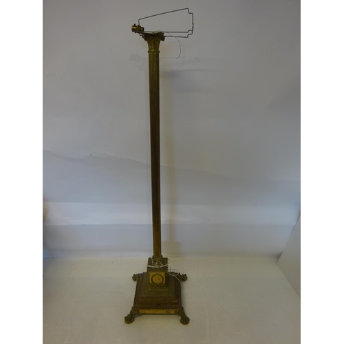 80 - A good old heavy brass floor lamp, the long cornithian column raised on square stepped base with cla... 