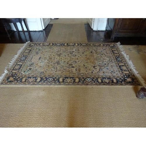 86 - A good quality Persian rug from the hall. 79cm x 126cm approx.