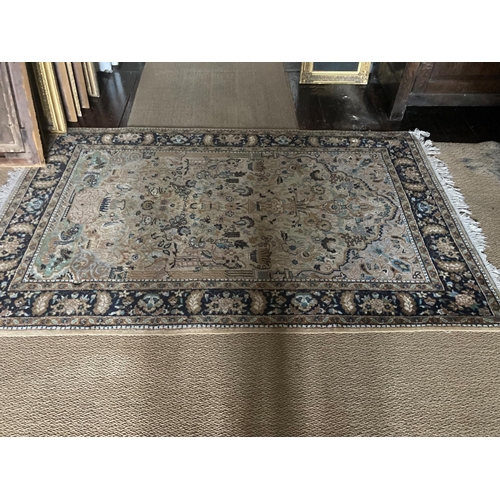 86 - A good quality Persian rug from the hall. 79cm x 126cm approx.