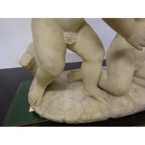 94 - A large old marble figure of two cherubs with bird on oval shaped base. W. 54cm, H. 50cm approx.