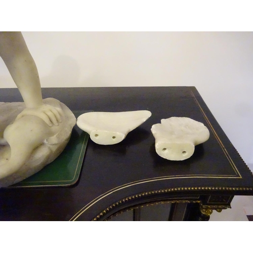 94 - A large old marble figure of two cherubs with bird on oval shaped base. W. 54cm, H. 50cm approx.