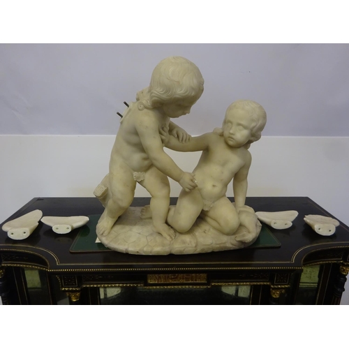 94 - A large old marble figure of two cherubs with bird on oval shaped base. W. 54cm, H. 50cm approx.