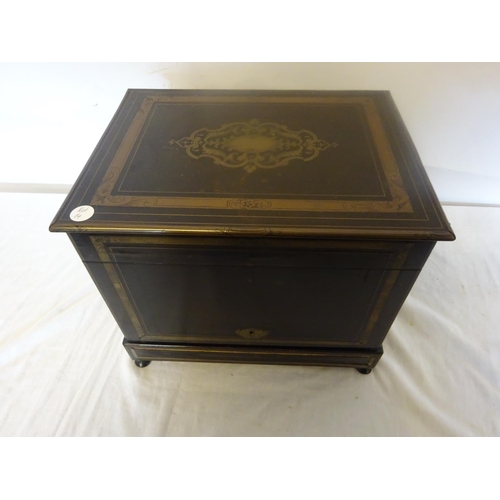 97 - Antique brass inlaid decanter box fitted with four decanters and fourteen small glasses (2 missing).