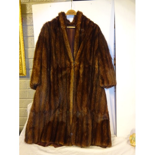 72 - Good quality full length fur coat.