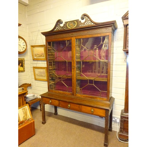 497 - A fine antique mahogany bookcase, the upper section having decorative swan neck cornice over two sec... 