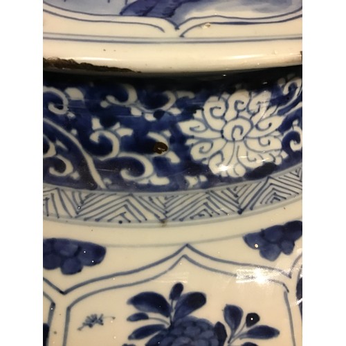 215 - A good pair of large antique Chinese blue and white baluster jars and covers, painted throughout wit... 