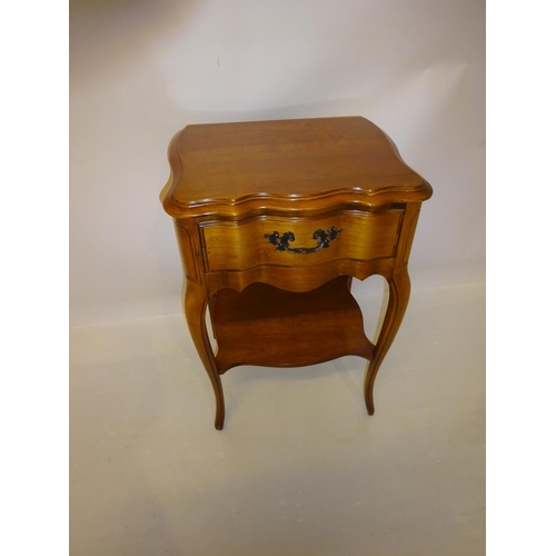 28 - Cherry wood lamp table fitted with a drawer and under tray. H. 72cm, W. 50cm, D. 40cm.