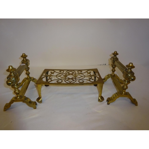 29 - Pair of brass fire dogs and brass trivet.