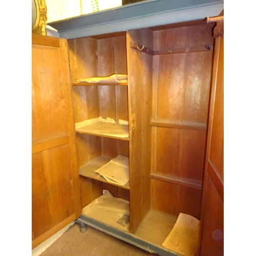 30 - Old painted pine two door press with shelved interior. W. 135cm, D. 55cm, H. 190cm approx.