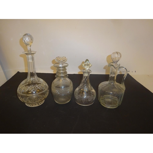 376 - Four antique glass decanters and stoppers.