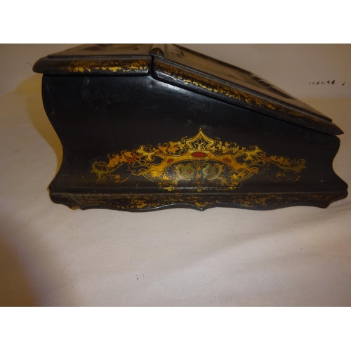 377 - A Victorian paper mache writing slope having landscape scenes and gilt decoration.