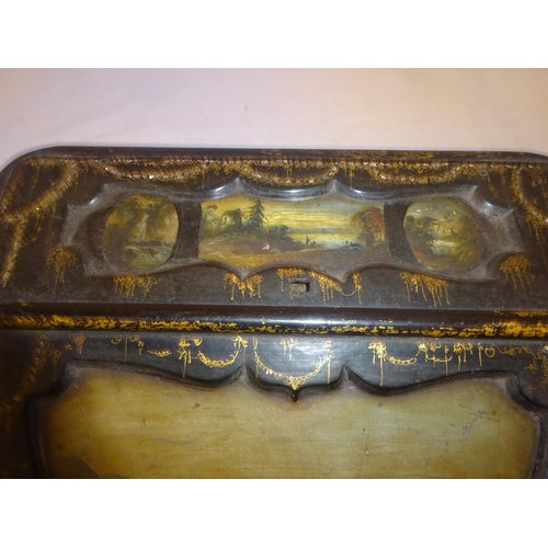 377 - A Victorian paper mache writing slope having landscape scenes and gilt decoration.