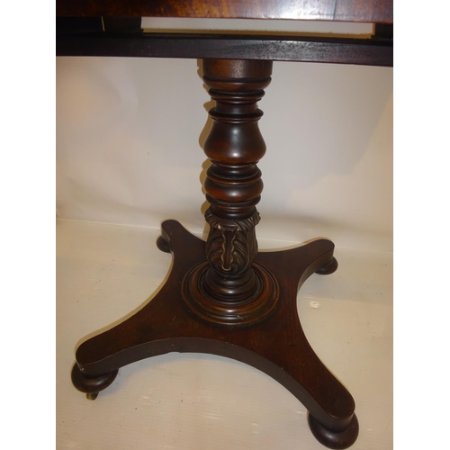 381 - Victorian mahogany games table raised on turned column and platform base. W. 76cm approx.