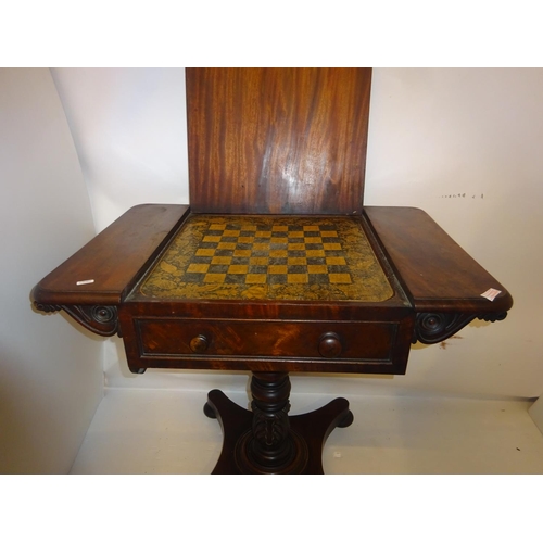 381 - Victorian mahogany games table raised on turned column and platform base. W. 76cm approx.