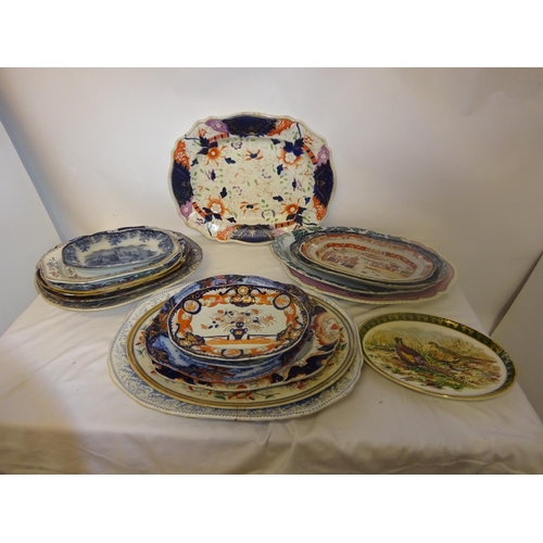 397 - A quantity of Victorian and later platters and plates.