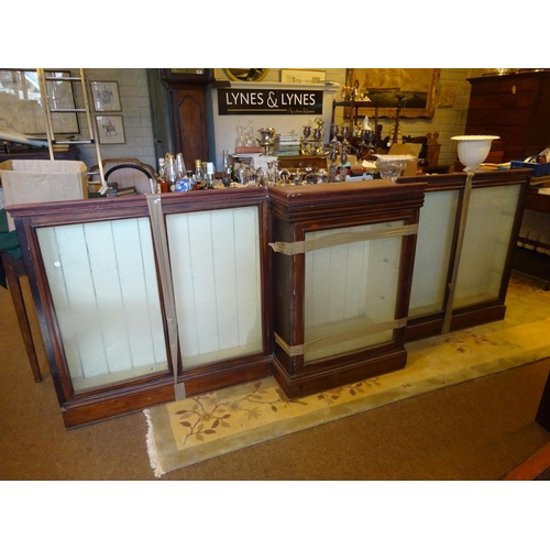 48 - Old timber breakfront shop cabinet with glass shelves, as found.  L. 265cm, H. 95cm approx.