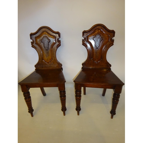 62 - Pair of Victorian mahogany hall chairs.