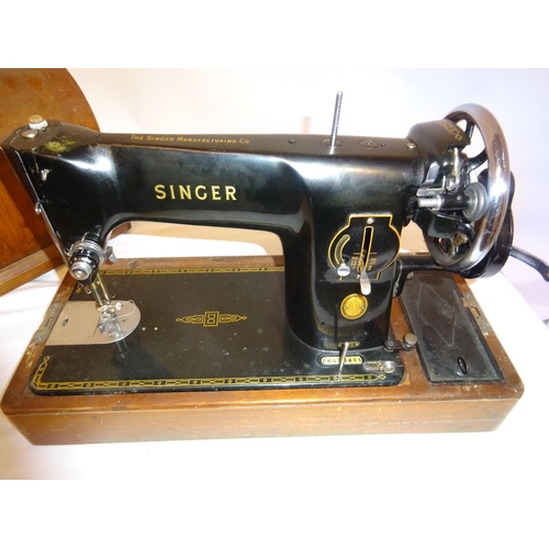 8 - Singer sewing machine with cover and key.