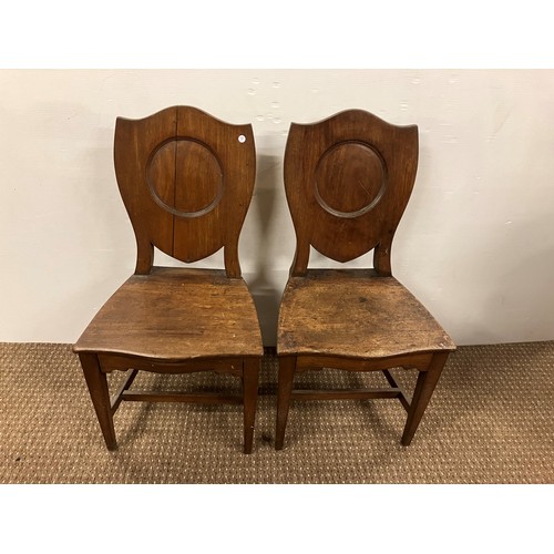 479 - Pair of Georgian mahogany shield back hall chairs.