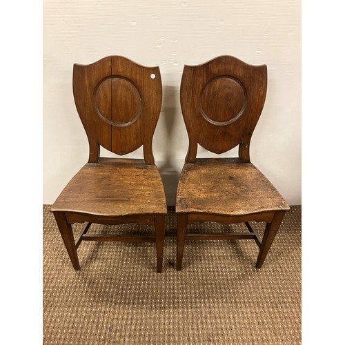 479 - Pair of Georgian mahogany shield back hall chairs.