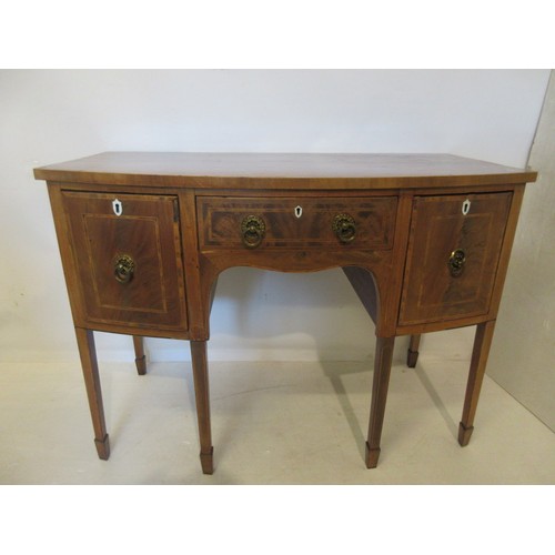 481 - Antique mahogany bow shaped sideboard raised on tapered legs.