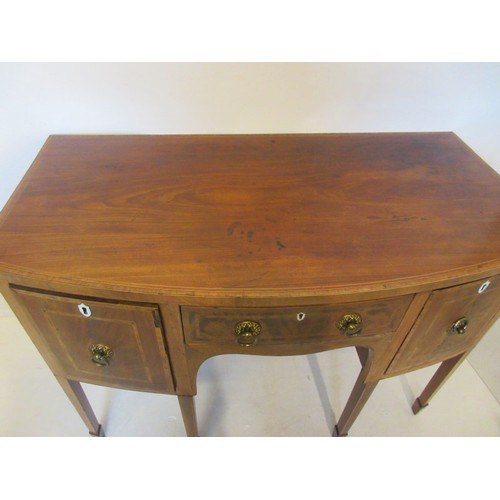 481 - Antique mahogany bow shaped sideboard raised on tapered legs.