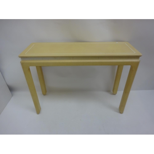 101 - A decorative painted side table raised on square legs. W. 117cm, D. 40cm, H. 85cm approx.